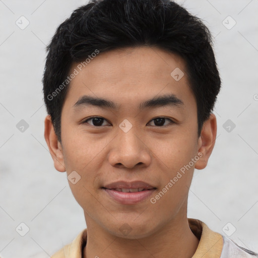 Joyful asian young-adult male with short  brown hair and brown eyes