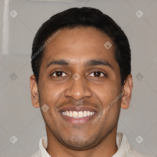 Joyful latino young-adult male with short  brown hair and brown eyes