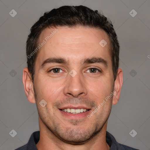 Joyful white adult male with short  brown hair and brown eyes