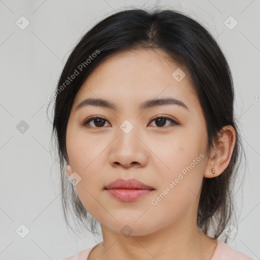 Joyful asian young-adult female with medium  black hair and brown eyes