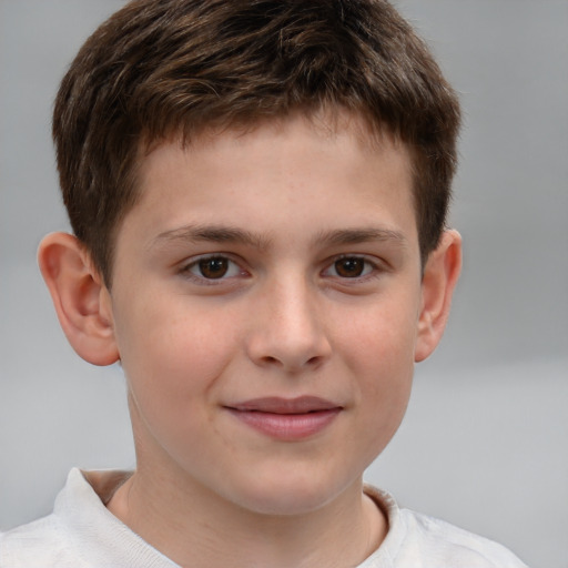 Joyful white child male with short  brown hair and brown eyes