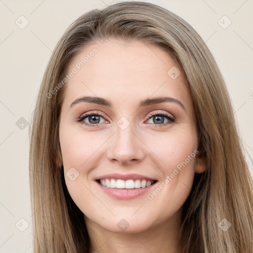 Joyful white young-adult female with long  brown hair and grey eyes