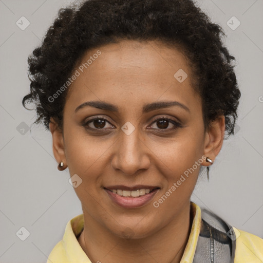 Joyful black young-adult female with short  brown hair and brown eyes