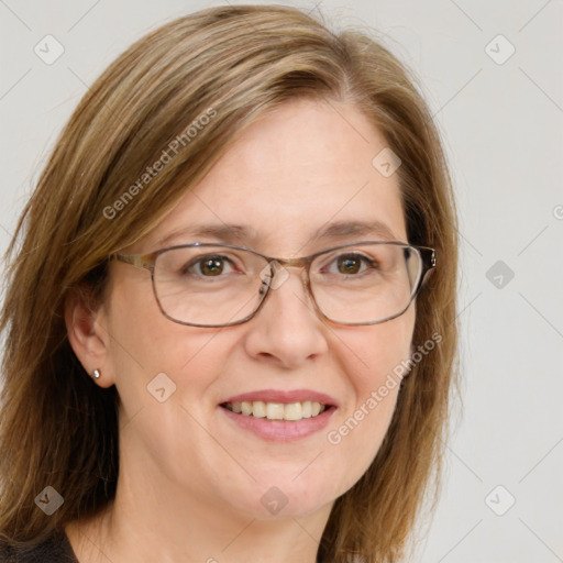 Joyful white adult female with medium  brown hair and blue eyes