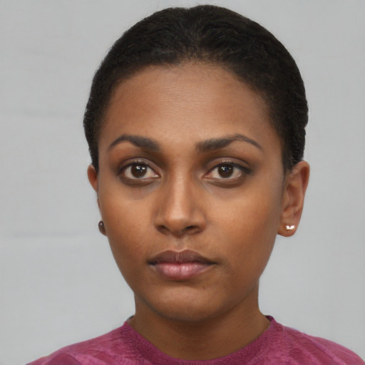 Neutral black young-adult female with short  black hair and brown eyes