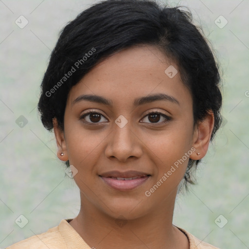 Joyful latino young-adult female with short  black hair and brown eyes