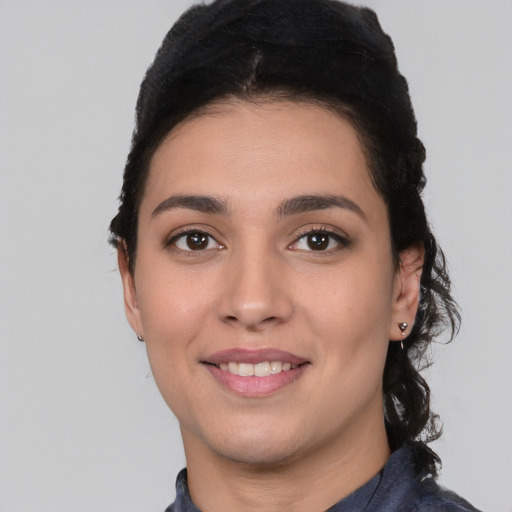 Joyful white young-adult female with short  black hair and brown eyes