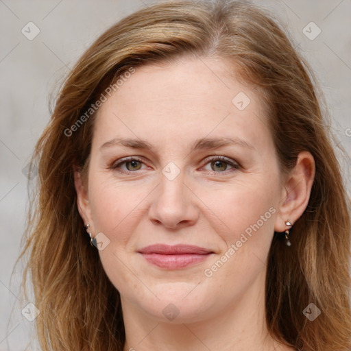 Joyful white young-adult female with long  brown hair and blue eyes