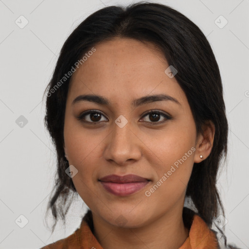 Joyful latino young-adult female with medium  brown hair and brown eyes