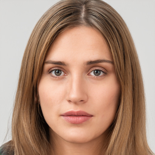 Neutral white young-adult female with long  brown hair and brown eyes