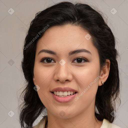 Joyful latino young-adult female with medium  brown hair and brown eyes