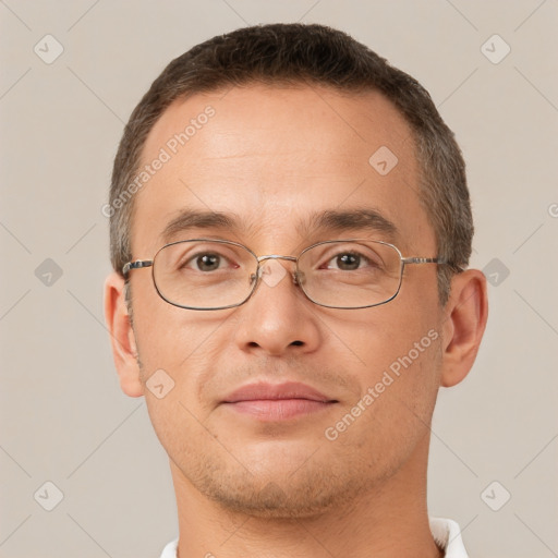 Joyful white adult male with short  brown hair and brown eyes