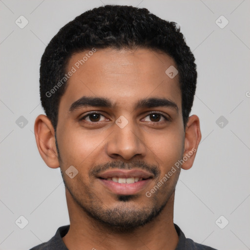 Joyful latino young-adult male with short  black hair and brown eyes