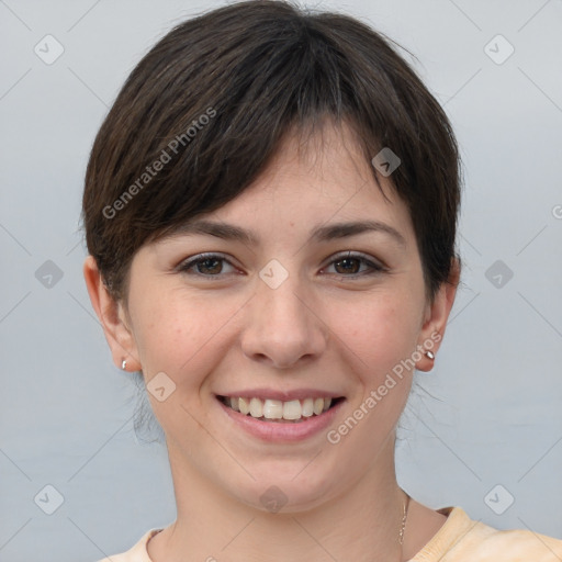 Joyful white young-adult female with short  brown hair and brown eyes