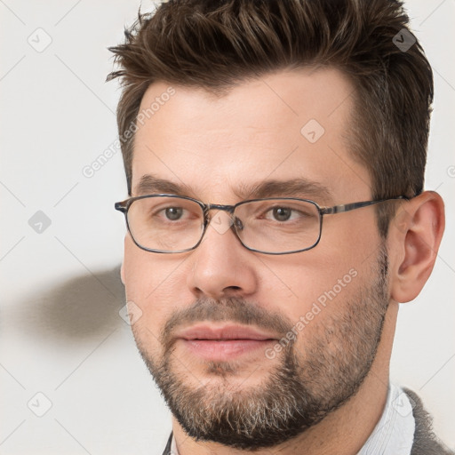 Joyful white adult male with short  brown hair and brown eyes