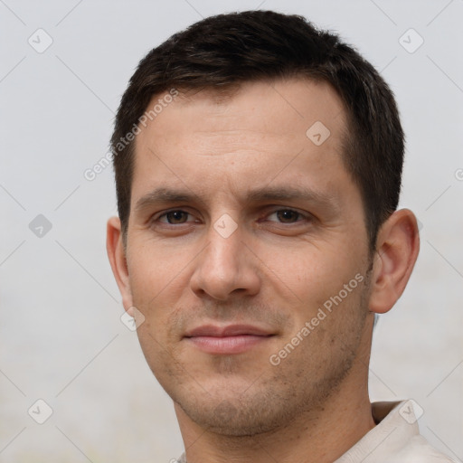 Joyful white young-adult male with short  brown hair and brown eyes