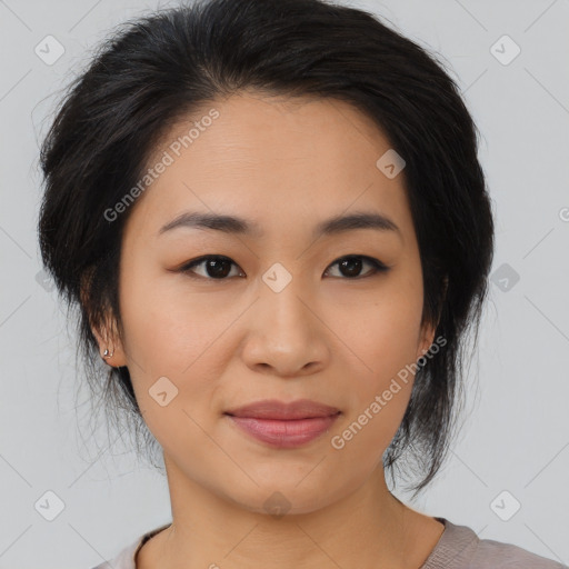 Joyful asian young-adult female with medium  black hair and brown eyes