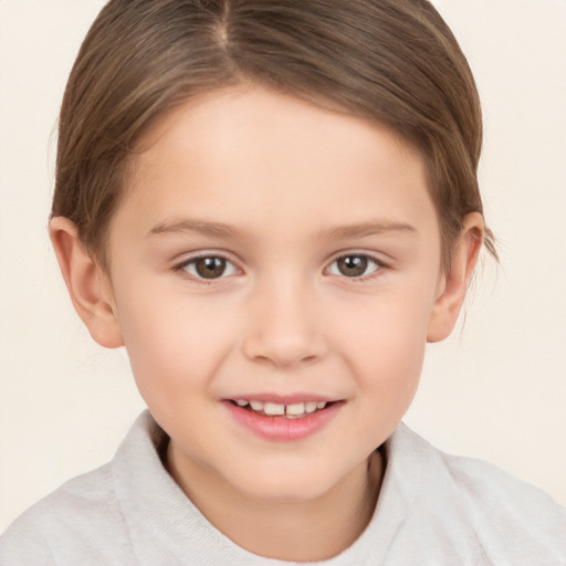 Joyful white child female with short  brown hair and brown eyes