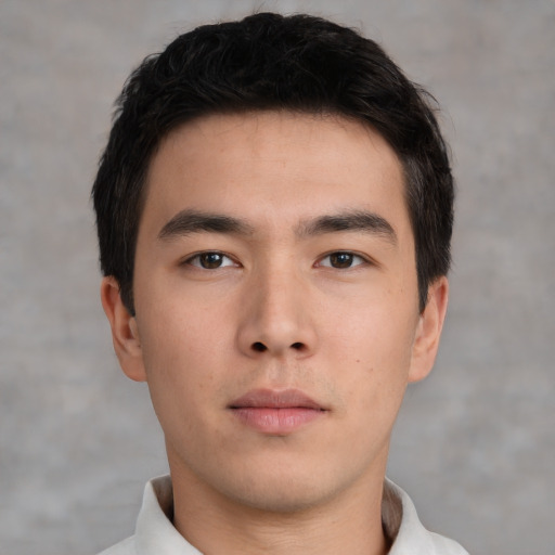 Neutral asian young-adult male with short  brown hair and brown eyes