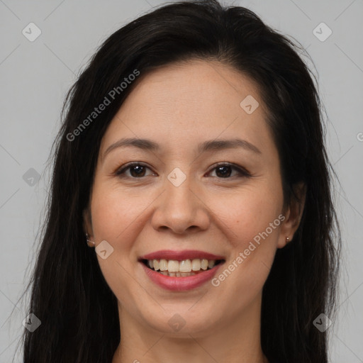 Joyful asian young-adult female with long  brown hair and brown eyes