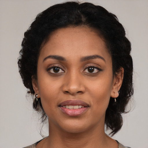 Joyful latino young-adult female with medium  black hair and brown eyes