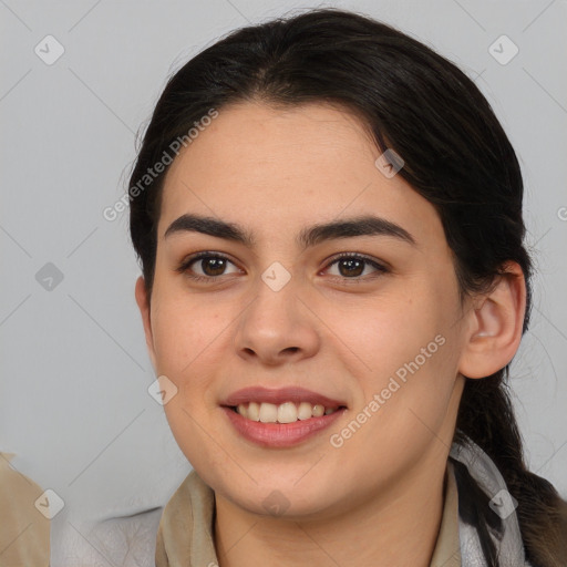 Joyful white young-adult female with long  brown hair and brown eyes