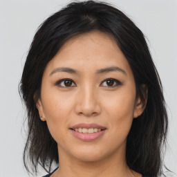 Joyful asian young-adult female with medium  brown hair and brown eyes