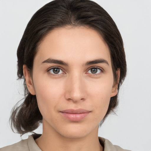 Neutral white young-adult female with medium  brown hair and brown eyes