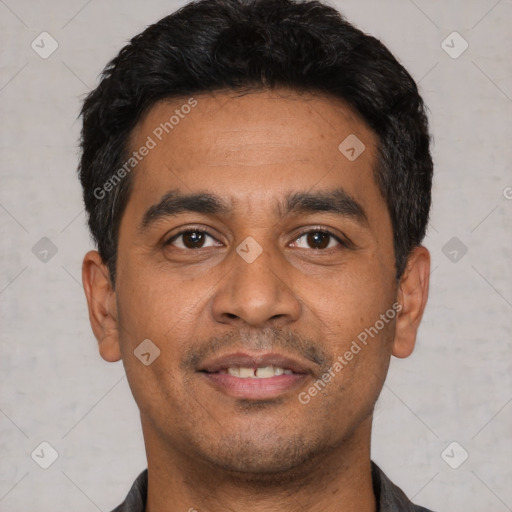 Joyful latino young-adult male with short  black hair and brown eyes