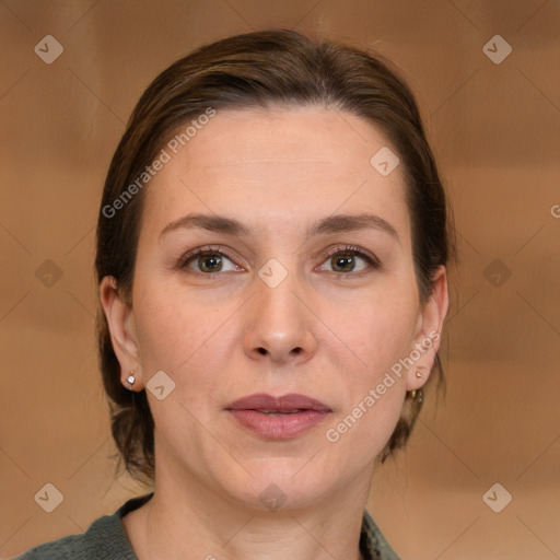 Joyful white adult female with medium  brown hair and brown eyes