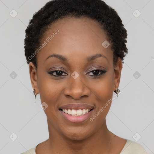 Joyful black young-adult female with short  black hair and brown eyes