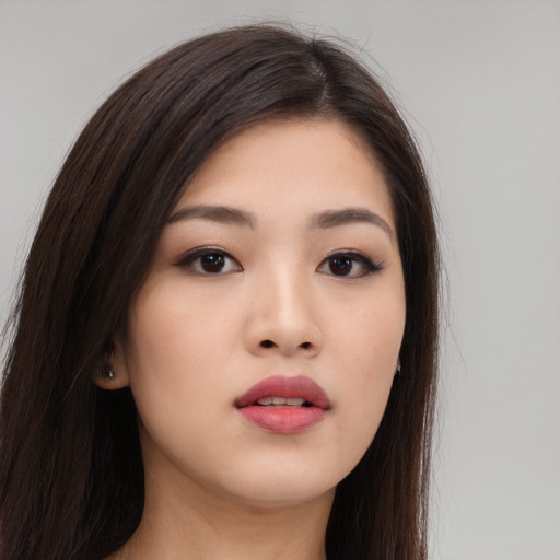 Neutral asian young-adult female with long  brown hair and brown eyes