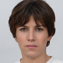 Neutral white young-adult female with short  brown hair and brown eyes