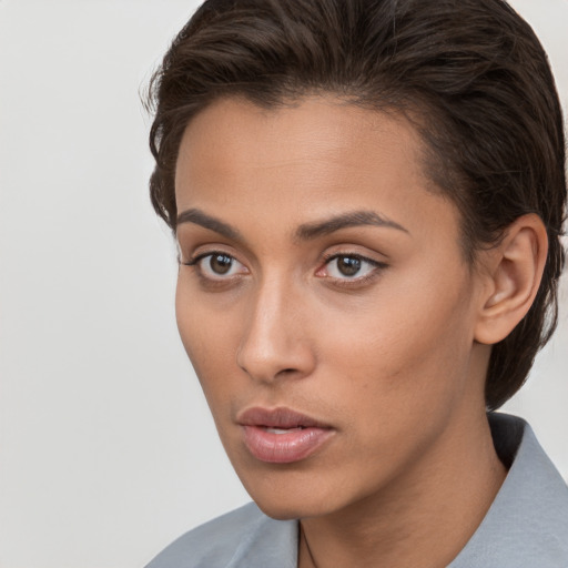 Neutral white young-adult female with short  brown hair and brown eyes