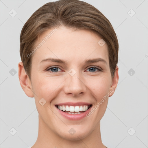 Joyful white young-adult female with short  brown hair and grey eyes