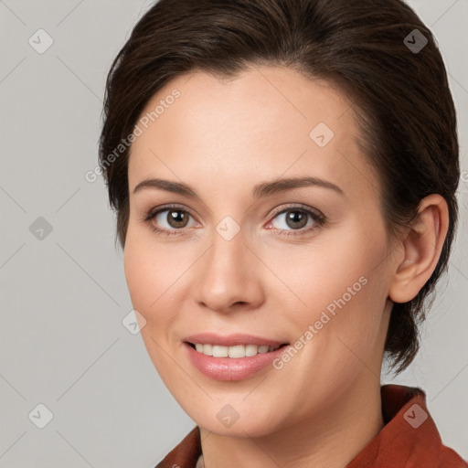 Joyful white young-adult female with medium  brown hair and grey eyes