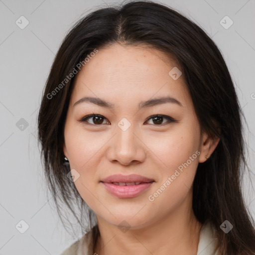 Joyful asian young-adult female with long  brown hair and brown eyes