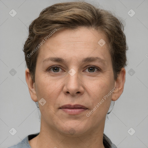 Joyful white adult female with short  brown hair and grey eyes