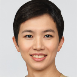 Joyful asian young-adult female with short  black hair and brown eyes