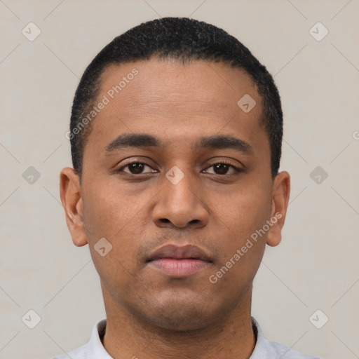 Neutral latino young-adult male with short  black hair and brown eyes