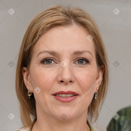 Joyful white adult female with medium  brown hair and grey eyes