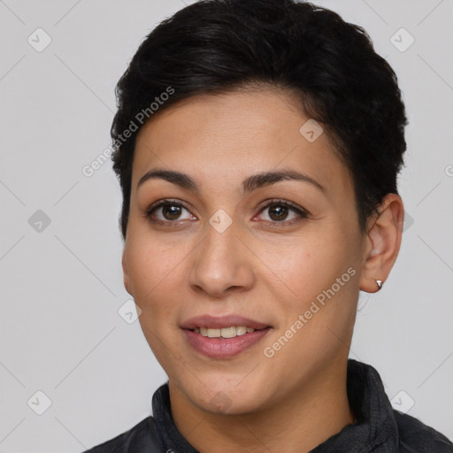 Joyful latino young-adult female with short  black hair and brown eyes