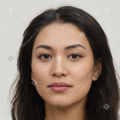 Joyful latino young-adult female with long  brown hair and brown eyes