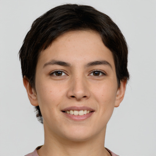 Joyful white young-adult female with short  brown hair and brown eyes