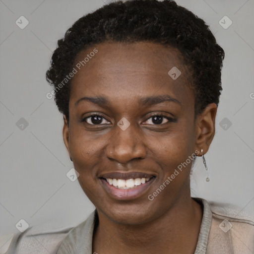 Joyful black young-adult female with short  brown hair and brown eyes