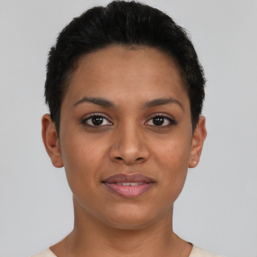Joyful latino young-adult female with short  brown hair and brown eyes