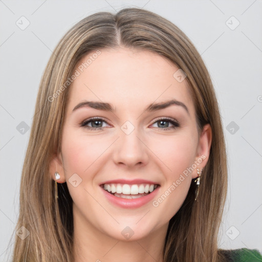 Joyful white young-adult female with long  brown hair and green eyes