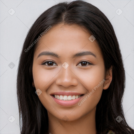 Joyful latino young-adult female with long  brown hair and brown eyes