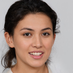 Joyful white young-adult female with medium  brown hair and brown eyes