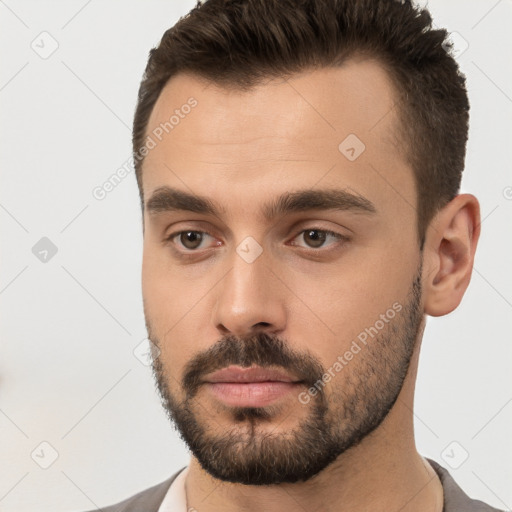 Neutral white young-adult male with short  brown hair and brown eyes